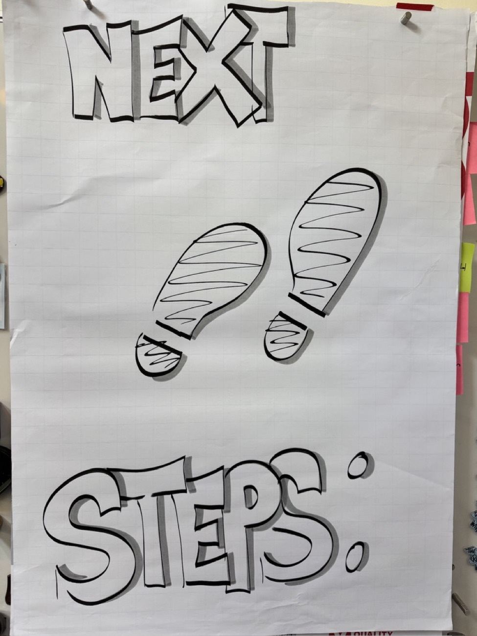 Flipover met Next Steps en twee grote getekende voetstappen.